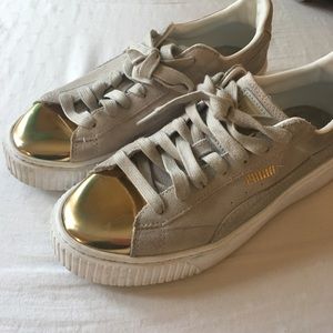 {Puma} Suede Sneakers with Gold Metallic Toes.